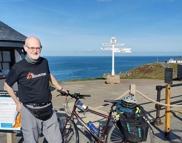 Phil Morcom with his bicycle at Land's End in Cornwall at the start of his 1,000-mile ride to John O'Groats on March 1, 2025.