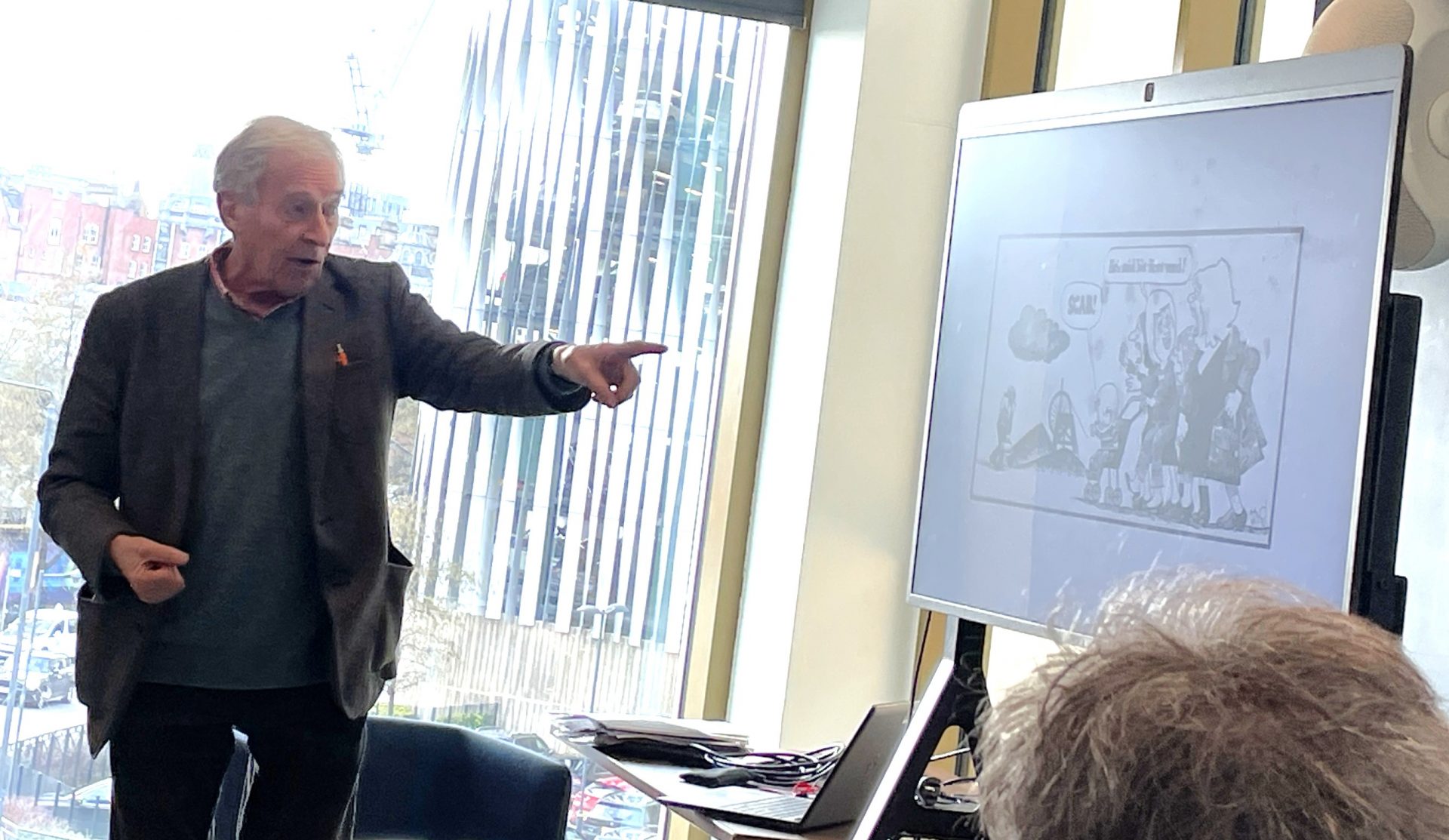 Man pointing at a whiteboard.