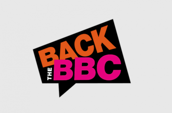 A black speech bubble similar in shape to a megaphone with the words Back The BBC inside it. The wording is orange, white and pink