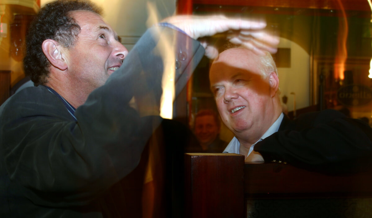 NUJ member Andrew Bibby from Hebden Bridge, left, is in animated conversation with Michael Meadowcroft, right, at the celebration of the centenary of an NUJ branch in Leeds in October 2006.