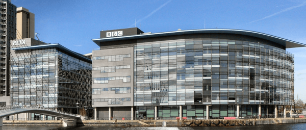 The BBC offices and studios building at Media City (Salford UK) pictured from a canal.